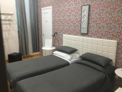 a bedroom with a large bed in a room at La Maison in Manfredonia