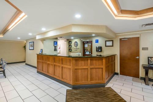 a large lobby with a waiting room with a counter at Comfort Inn University in Gainesville