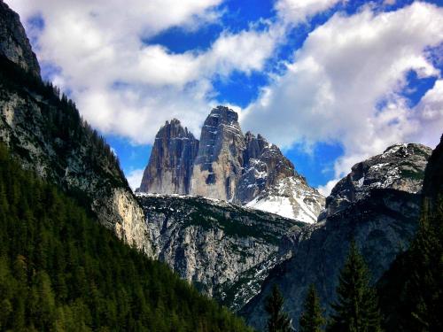 a view of a mountain with snow on it at Hotel al Sole in Auronzo di Cadore