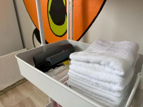 a drawer filled with towels in a room at mkh room TAKAMATSU in Takamatsu
