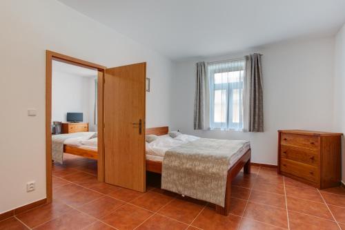 Postel nebo postele na pokoji v ubytování Apartmány U Anděla