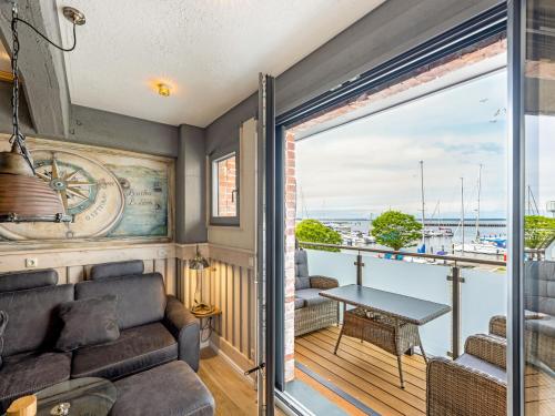 a living room with a couch and a table at Lütt Haven in Barth