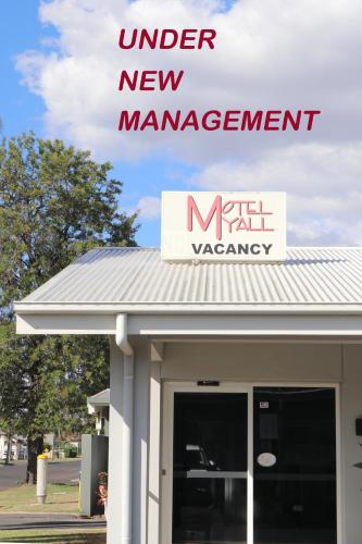a new management sign on top of a building at Motel Myall in Dalby