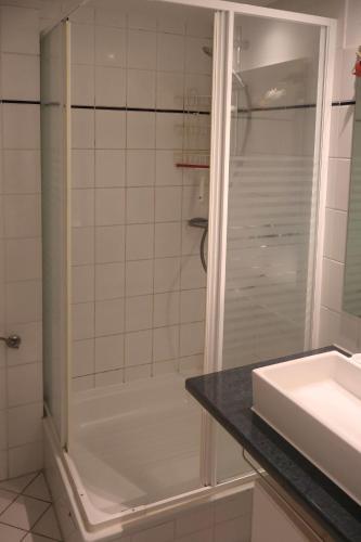 a bathroom with a shower and a sink at Ferienwohnung Ortlieb Laboe in Laboe