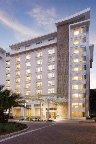 a large white building with many windows at The Lowline Hotel, part of JdV by Hyatt in Charleston