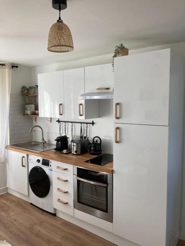 Køkken eller tekøkken på L'Appartement Vert