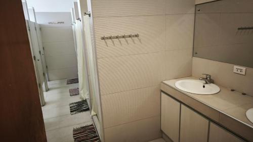 a bathroom with a sink and a shower at Pension Natividad in Manila