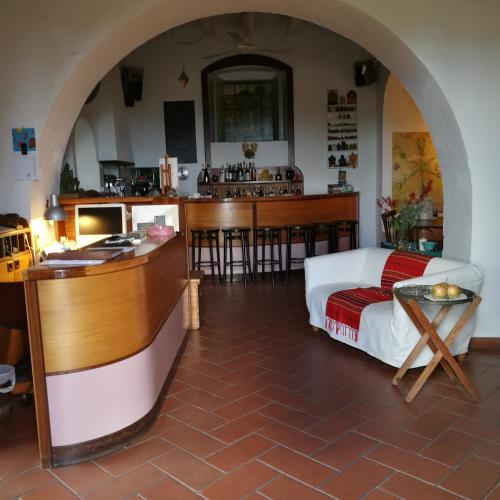 a living room with a bed and a kitchen at La Locanda del Barbablù in Stromboli