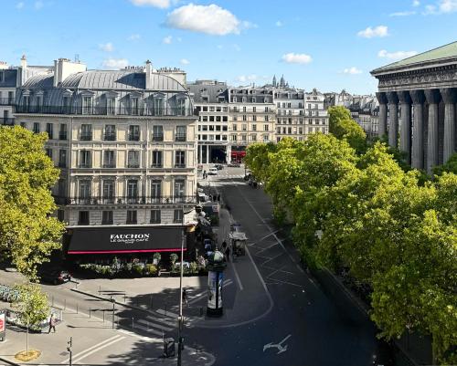 a view of a city with buildings and a street at Fauchon l'Hôtel Paris in Paris