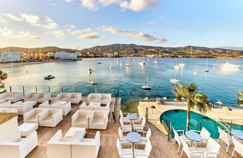 a hotel with a view of a body of water at Leonardo Royal Hotel Mallorca in Palmanova