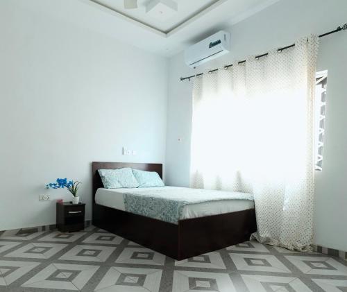 Llit o llits en una habitació de AnKeS Lodge