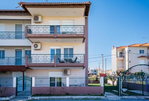 a building with balconies on the side of it at Villa Ilias in Flogita