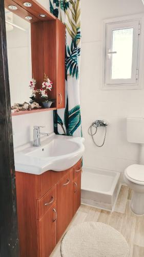 a bathroom with a sink and a toilet at Blue Pearl Molos in Mólos