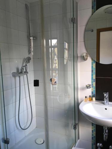 a bathroom with a shower and a sink at Landhotel Steffen in Lieser