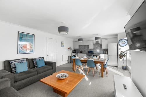 a living room with a couch and a table at Henry's Apartment in Dundee