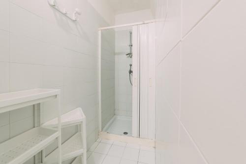 a white bathroom with a shower and a sink at Domus Gallipoli by Casa di Marco in Gallipoli