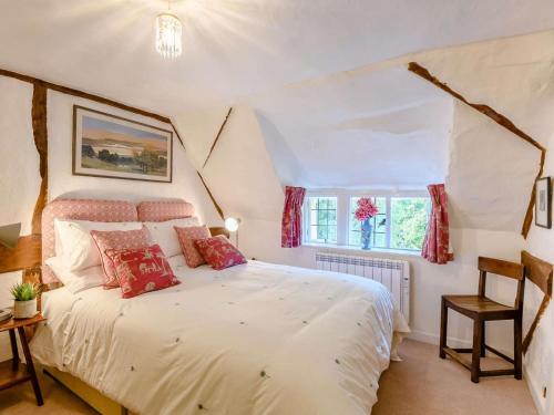 a bedroom with a white bed and a window at 2 Bed in Salisbury oc-88922 in Boreham