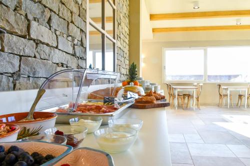 a buffet with a variety of food on a counter at Agriturismo De Ferrari in Onzo