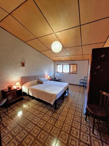 a bedroom with a large bed in a room at White Cottage - WelcHome in Mozzagrogna