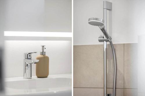 a bathroom with a shower and a sink with a blow dryer at OH513-Hadsund-Haslevgarde-Eng-14 in Hadsund
