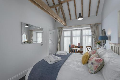 a large white bed in a room with a window at 1 Bed in Lowick oc-coq44 in Holburn