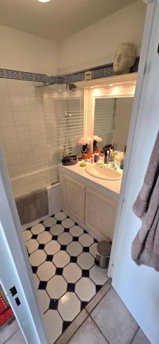 a bathroom with a tub and a sink and a toilet at Marseille Estaque in Marseille