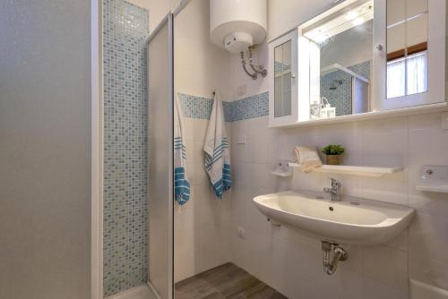 a bathroom with a sink and a shower at L11 Terrazza Maestrale in Stintino