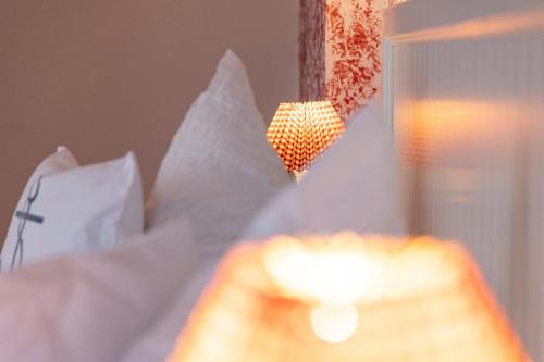 a close up of a hand reaching for a light at Hotel Anka in Norddorf