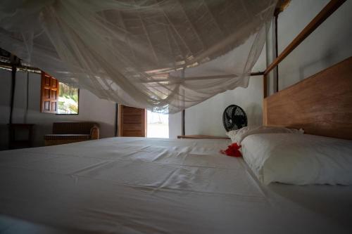 Кровать или кровати в номере Trinity Beach Villas