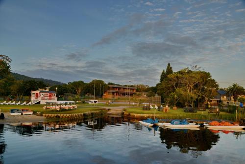 a group of boats sitting on the water at Baywater Village by MyResorts in Sedgefield