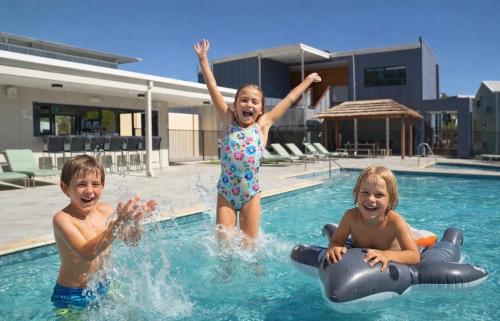 three children are playing in a swimming pool at Serenity & Sea at Preston Beach WA in Preston Beach