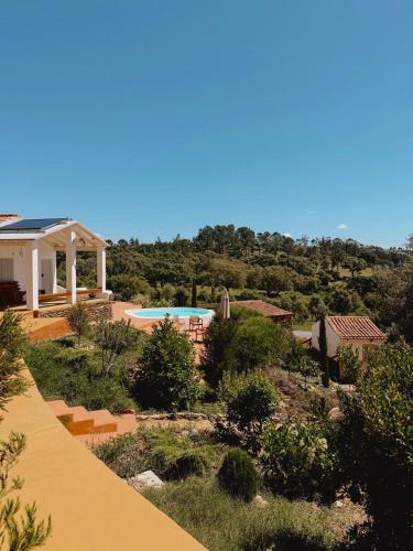 a view of a house with a swimming pool at Monte da Serra de Baixo By CABRA in Sines