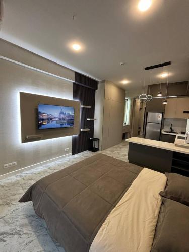 Телевизор и/или развлекательный центр в U-tower studio city view