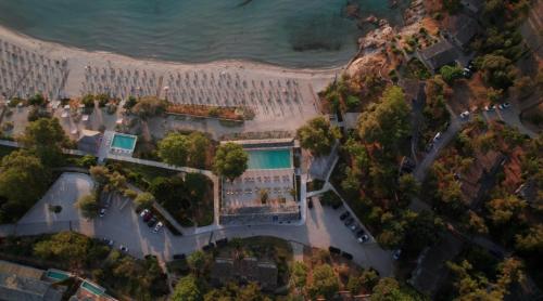 an overhead view of a beach with a resort at Makryammos in Limenas