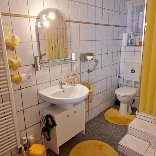 a bathroom with a sink and a toilet at Apartement in Berlin