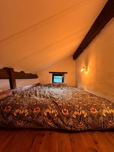 a bedroom with a bed in a attic at Tiny Gite La Petite Grue in Louroux-Bourbonnais