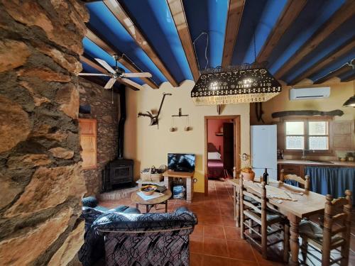 a living room with a stone wall at Amborget in Sant Jordi