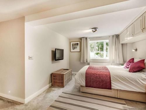 a bedroom with a bed and a window at 2 Bed in Harrogate oc-89622 in Summer Bridge