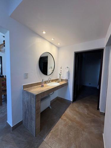 a bathroom with a sink and a mirror at Moller masi inti wayra in Purmamarca