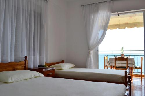 Una cama o camas en una habitación de Villa Panorma