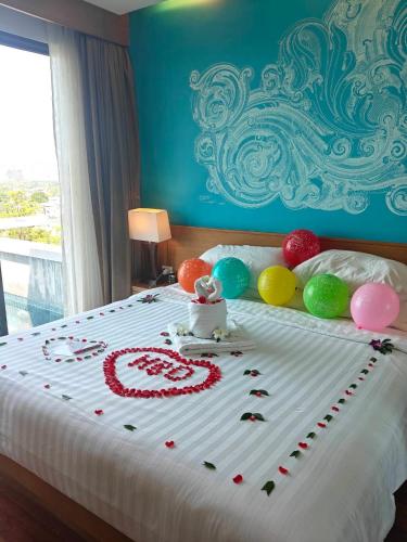 a bed with balloons and a number on it at Aonang Suite Pool Villa in Ao Nang Beach