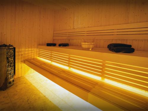 a sauna with a long bench in a room at Chalet Frontflip - OVO Network in La Clusaz