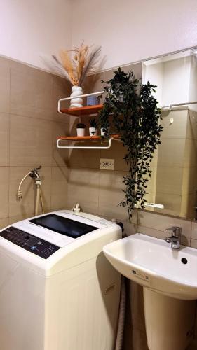 a bathroom with a sink and a mirror at Shore Residences TowerA in Manila