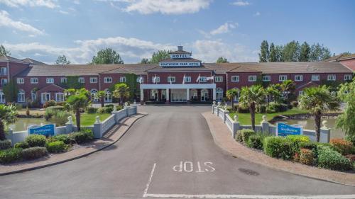 a large red building with a road in front of it at Southview Park Hotel in Skegness