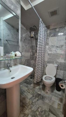 a bathroom with a sink and a toilet at PB325 Ideal studio apartment in Phuket in Ban Mai Salae