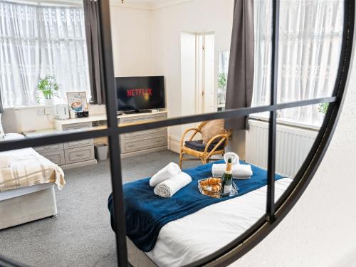 a room with a bed and a mirror at Rising Sun in Rogerstone