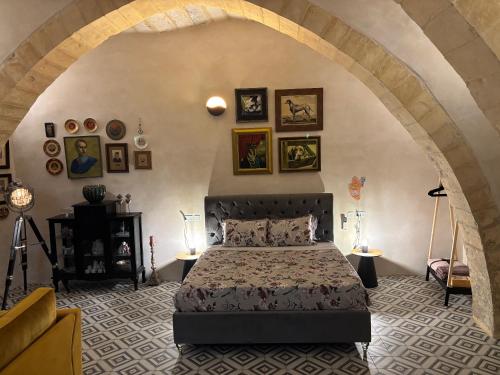 a bedroom with a large bed in an archway at 3 Doni in Rabat
