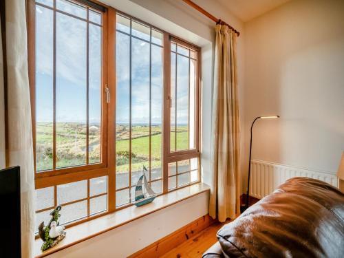 a living room with a large window with a view at 3 Bed in Renvyle oc-i254 in Cashleen