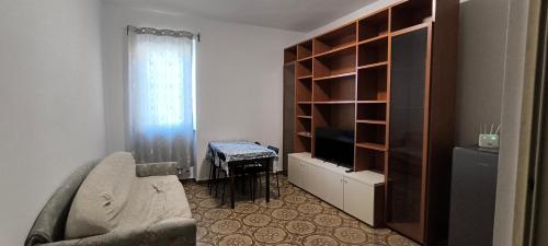 a living room with a couch and a tv at cristina in Pavia