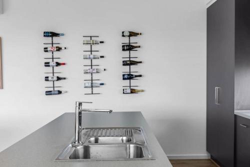 a kitchen counter with a sink and some shelves at Allawah in Encounter Bay